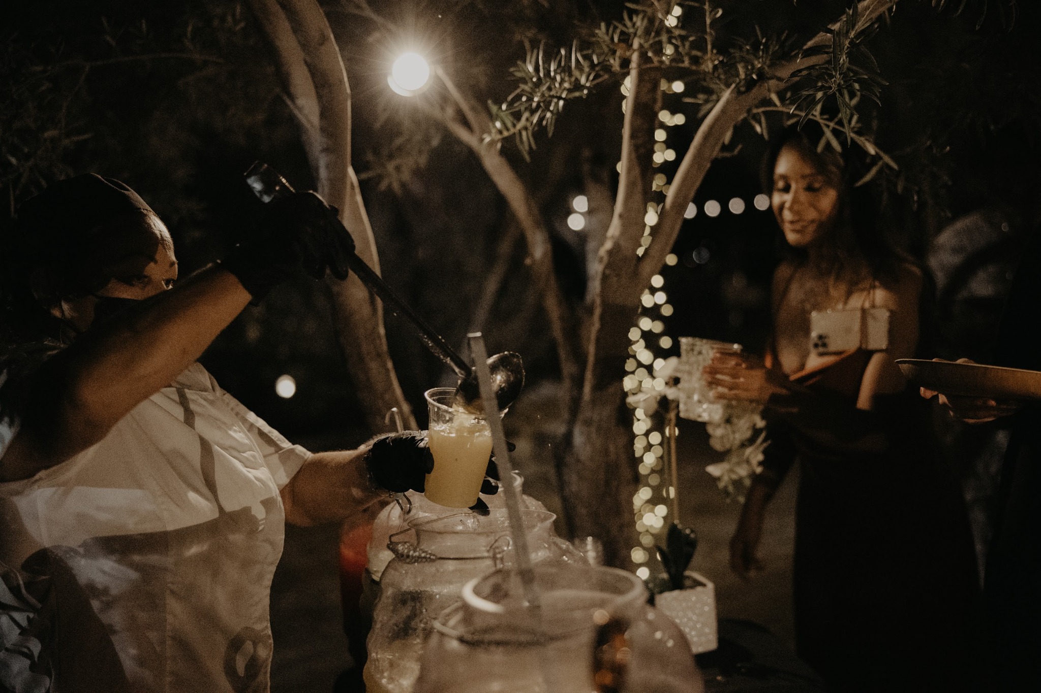 Fresh agua fresca being served at an evening event