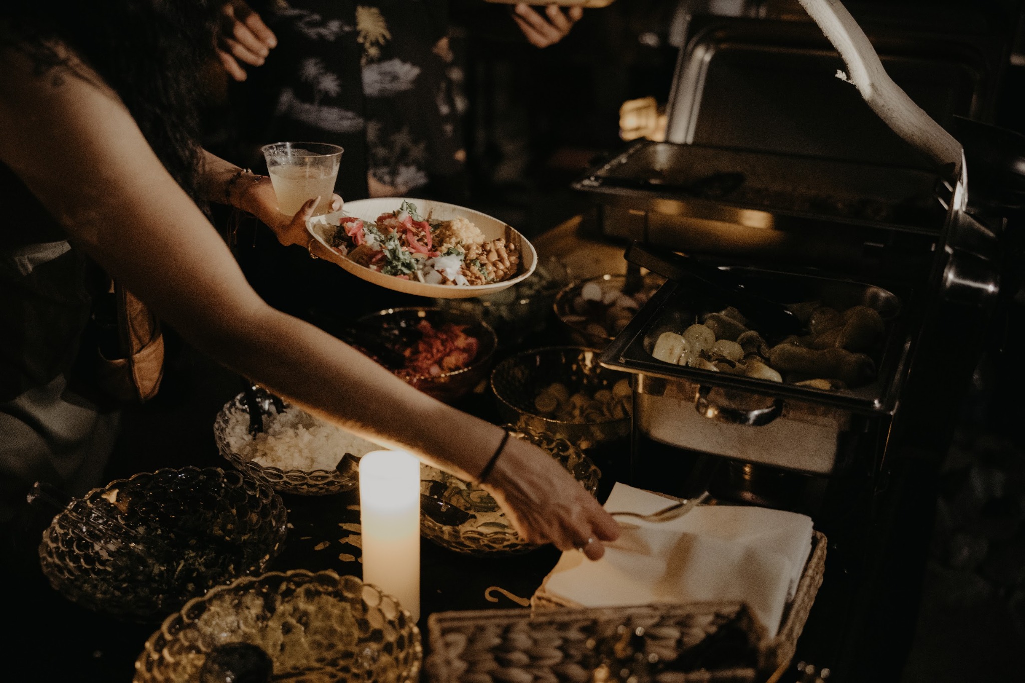 Guest being served from the Glorias Taquiza buffet